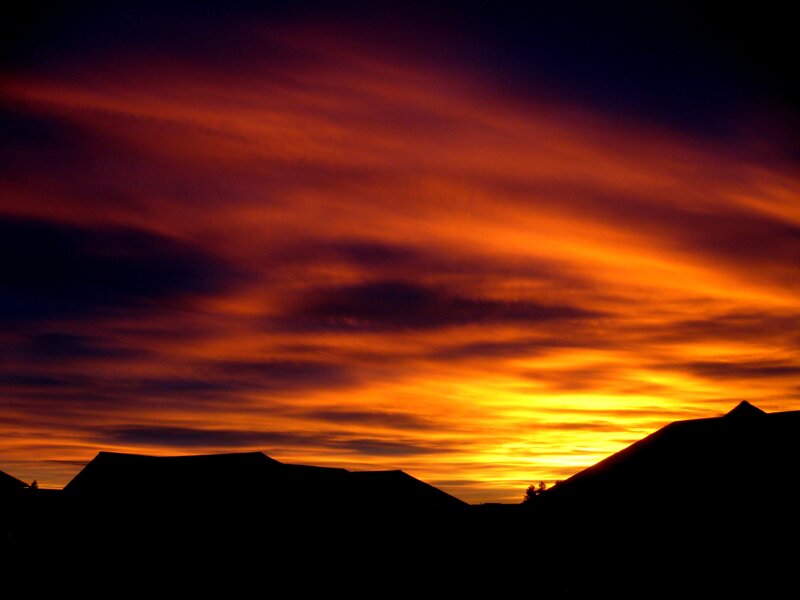 Silhouetted rooftops at sunset