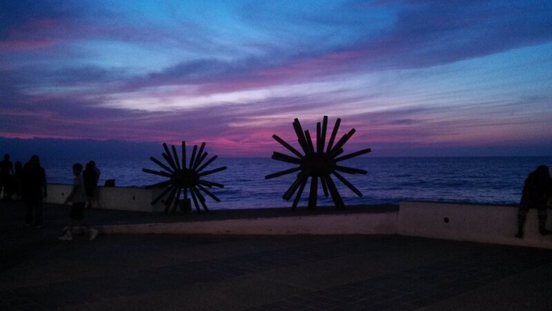 Silhouetted Sculptures at Dusk