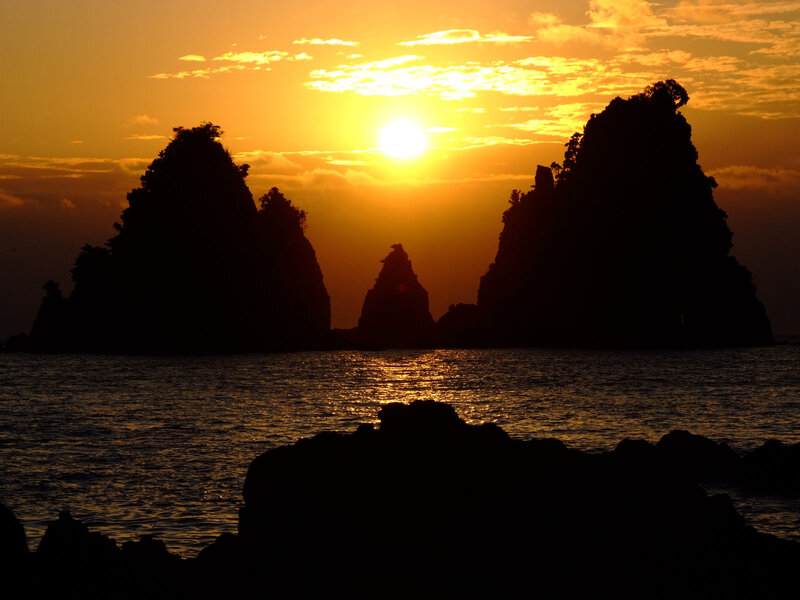 Silhouetted Sea Stacks — Orange, Serene, Sunset