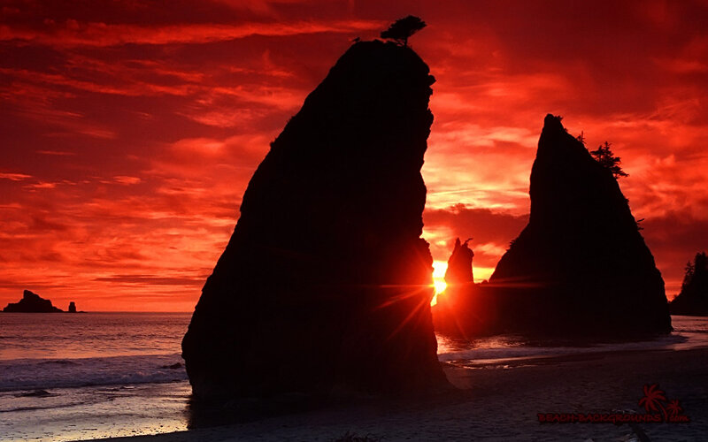 Silhouetted Sea Stacks — Red, Dramatic, Sunset, Photograph, Sun
