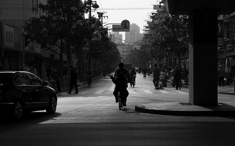 Silhouetted street scene in city