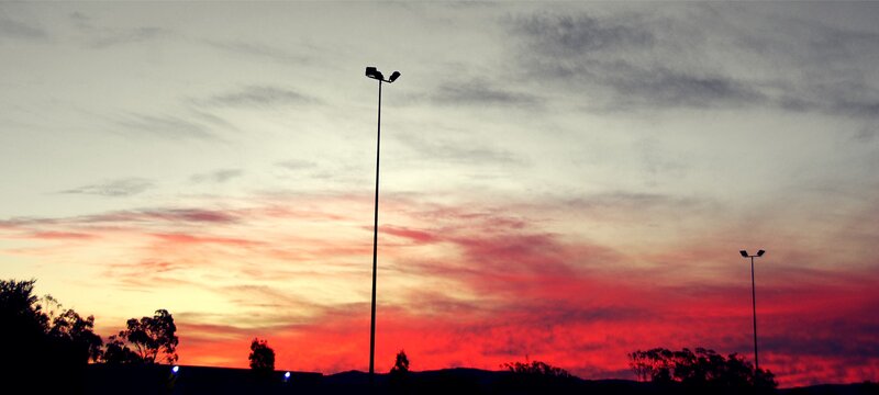 Silhouetted Streetlights — Red
