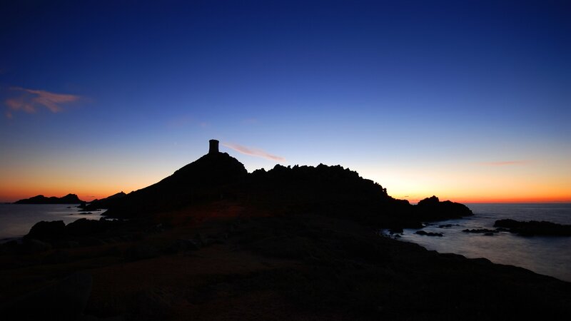 Silhouetted Tower on Rock