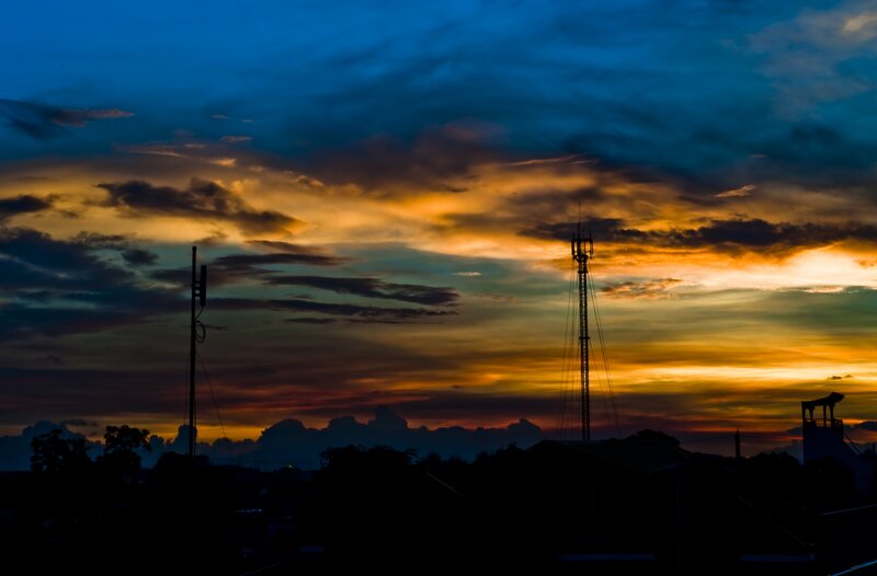 Silhouetted Towers at Dusk — Blue