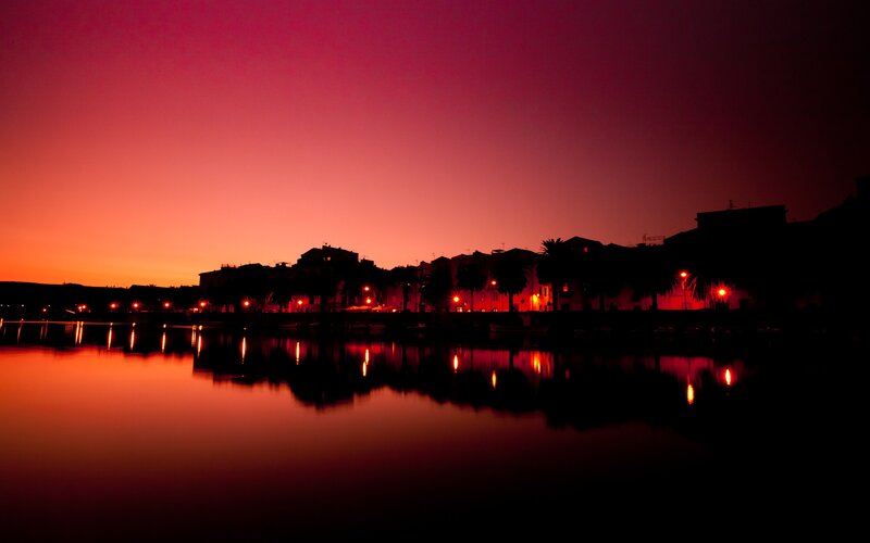 Silhouetted Town at Dusk — Red