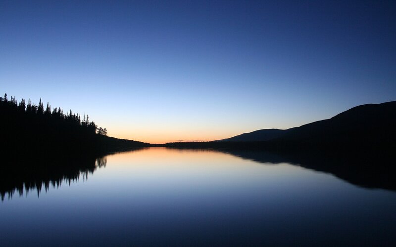 Silhouetted Trees and Mountains — Blue, Serene, Sunset