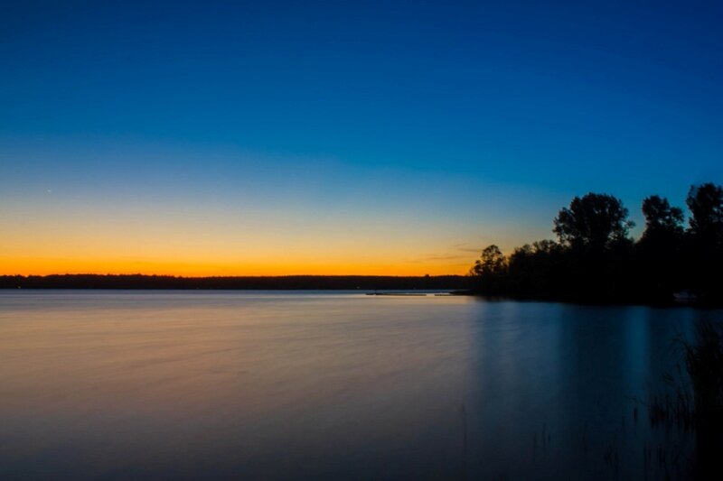 Silhouetted Trees at Lake — Blue, Serene, Sunset