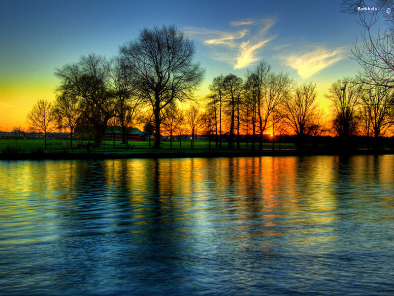 Silhouetted Trees at Sunset — Blue, Serene, Photograph, River