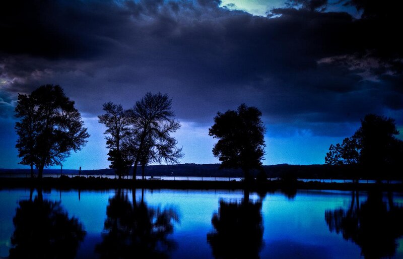 Silhouetted Trees by Lake — Blue, Dramatic