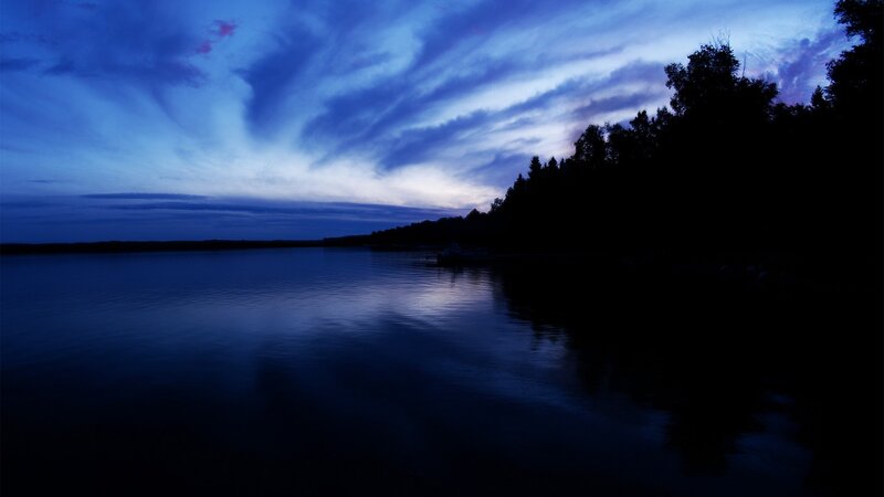 Silhouetted Trees on Lake — Clouds