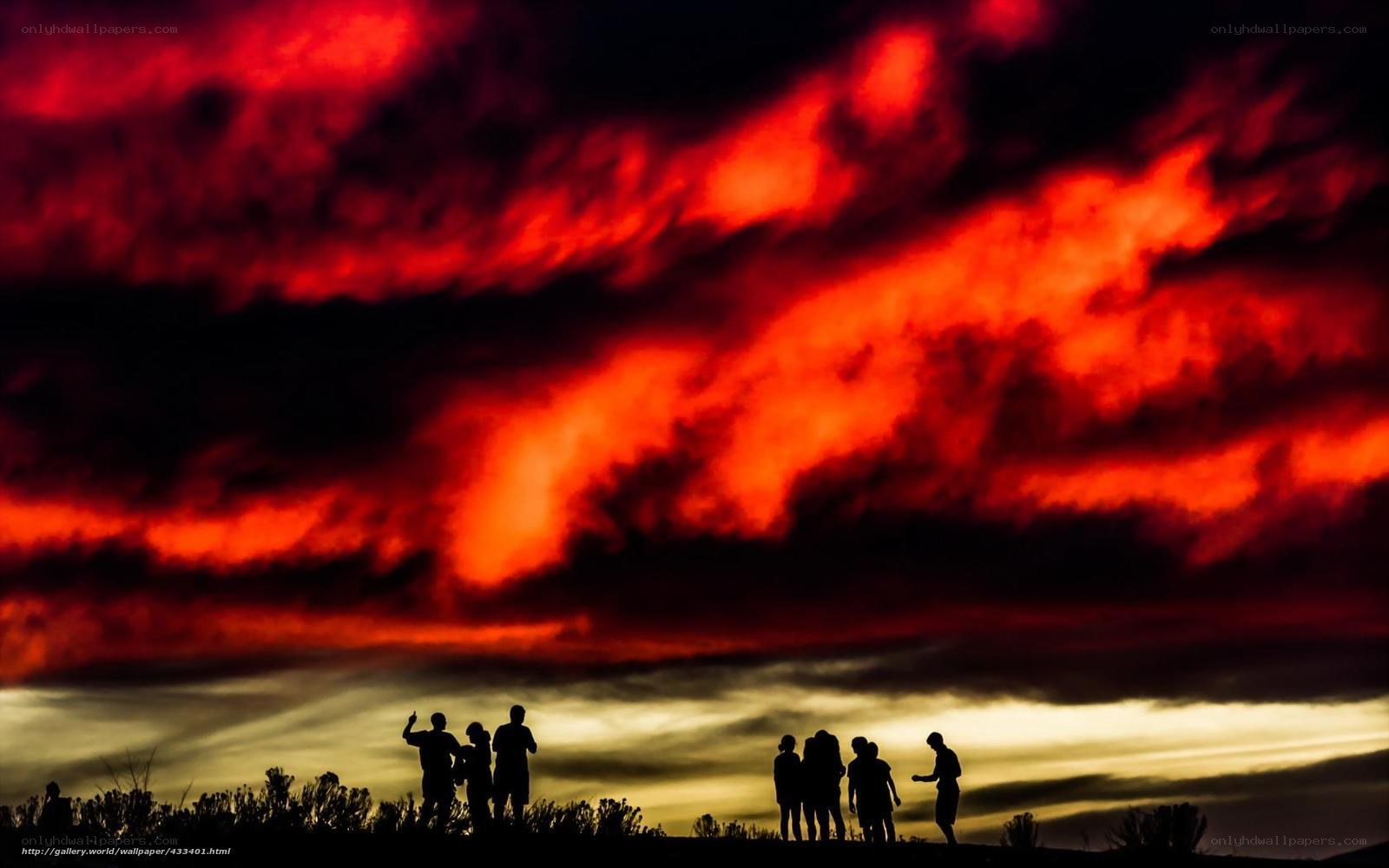 Silhouettes against a fiery sky