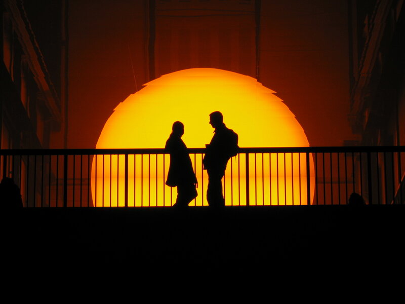 Silhouettes against a glowing sun