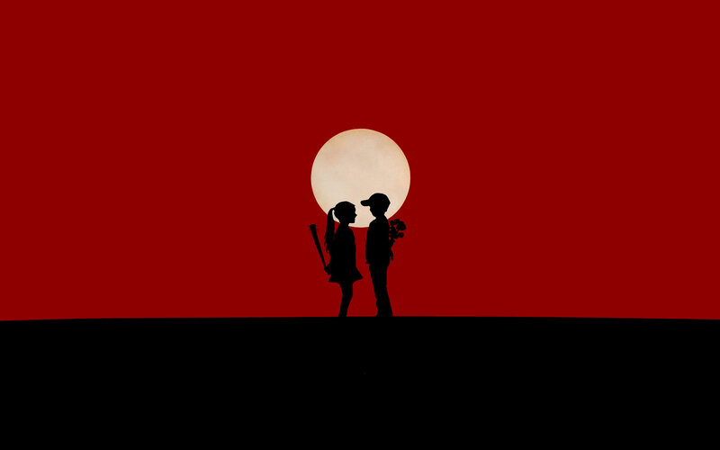 Silhouettes against red sky