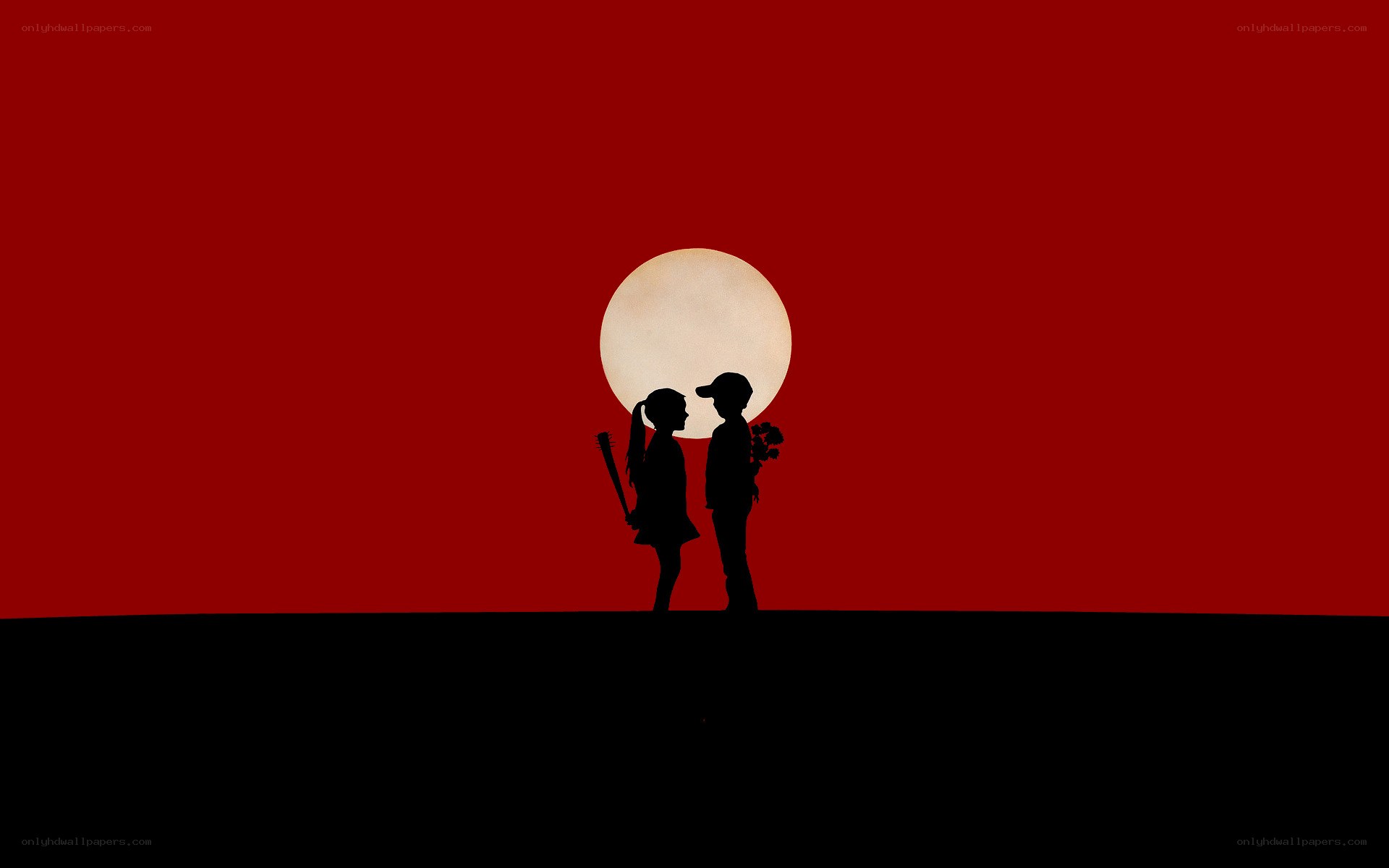 Silhouettes against red sky
