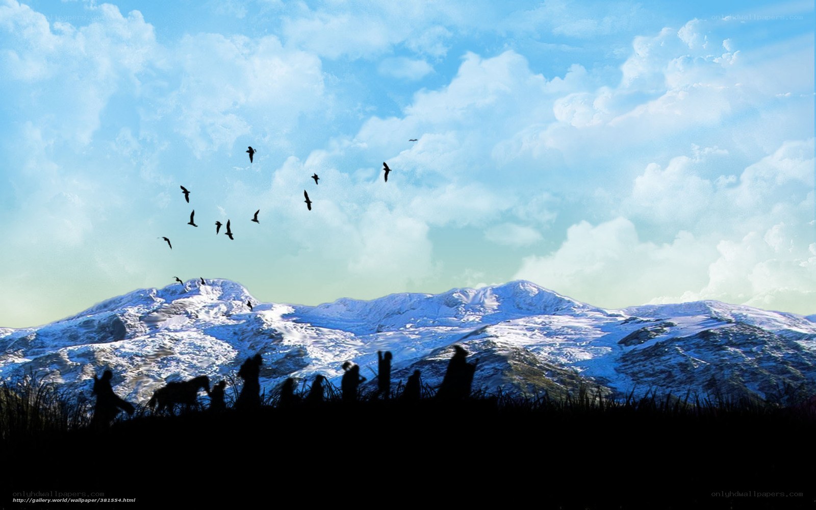 Silhouettes against snowy mountains