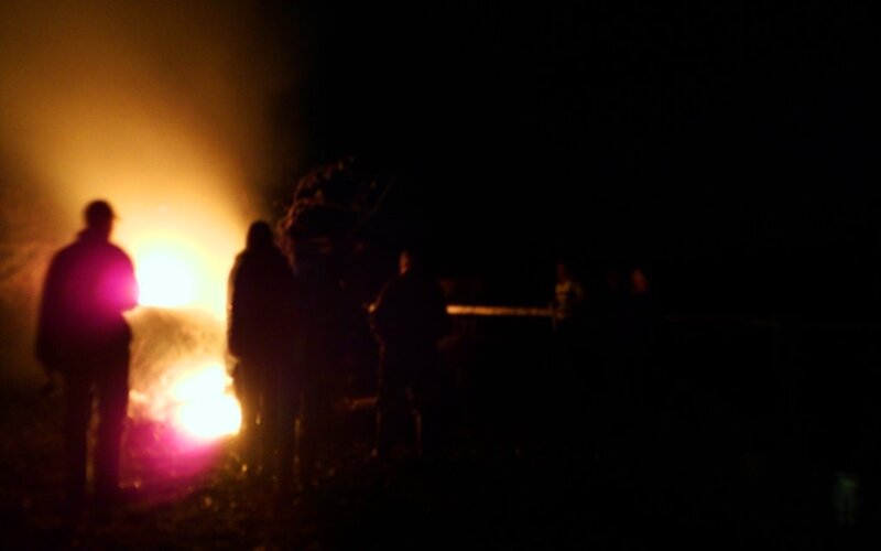 Silhouettes Around Fire