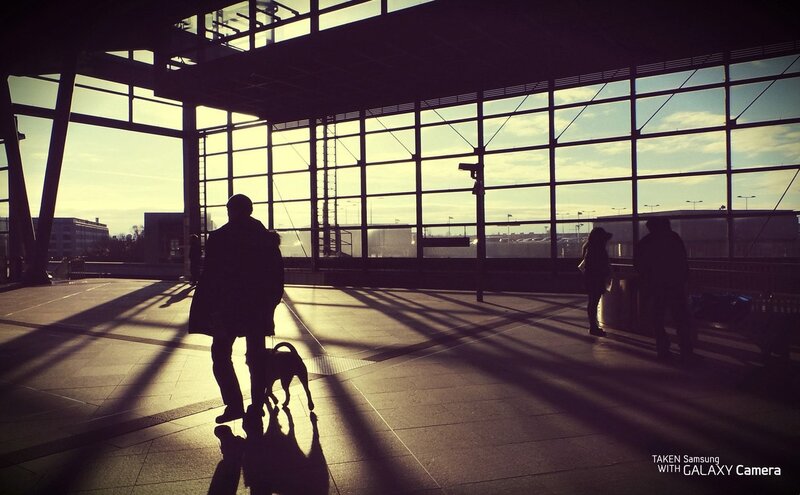 Silhouettes at a train station