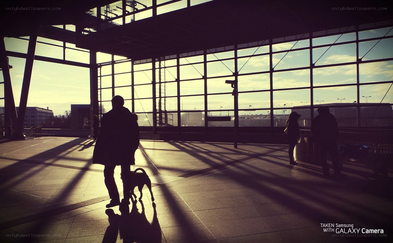 Silhouettes at a train station