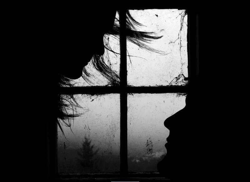 silhouettes at a window