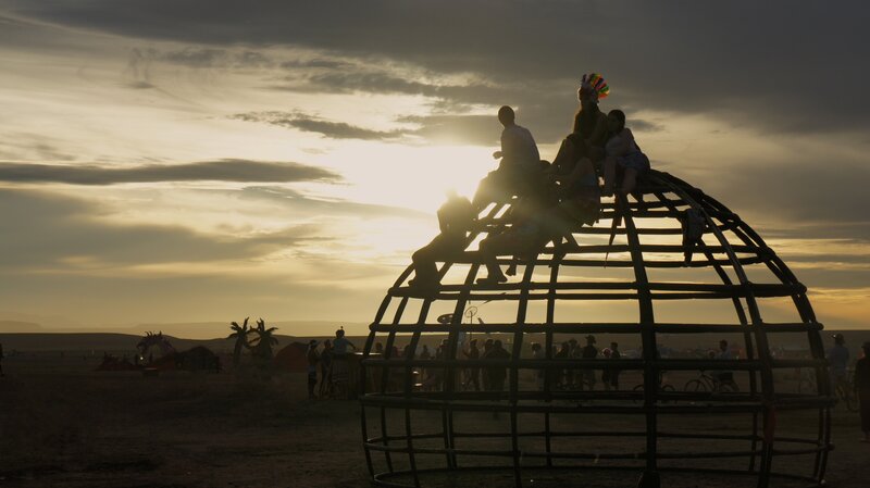 Silhouettes at festival sunset