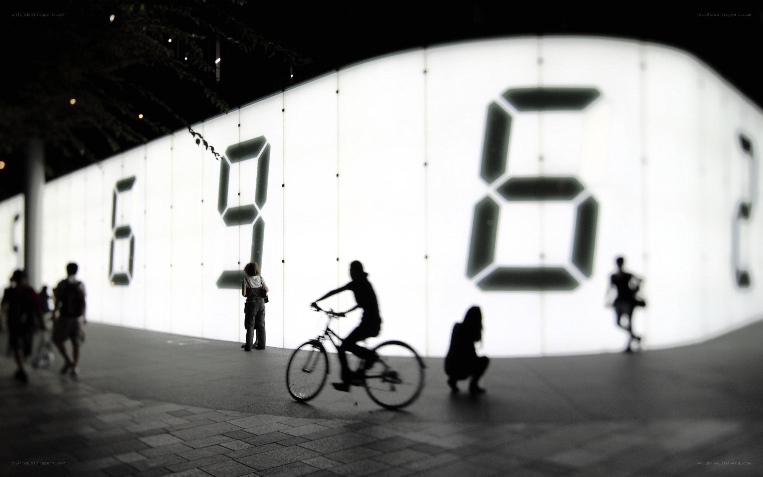 Silhouettes at Night with Digital Clock