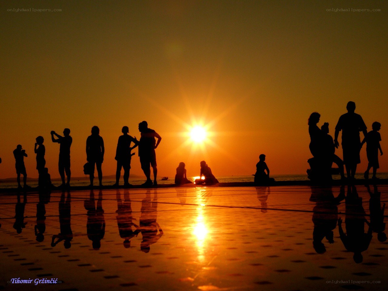 Silhouettes at sunset on the beach