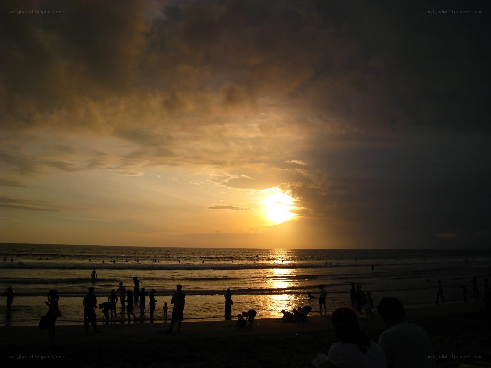 Silhouettes at sunset on the beach
