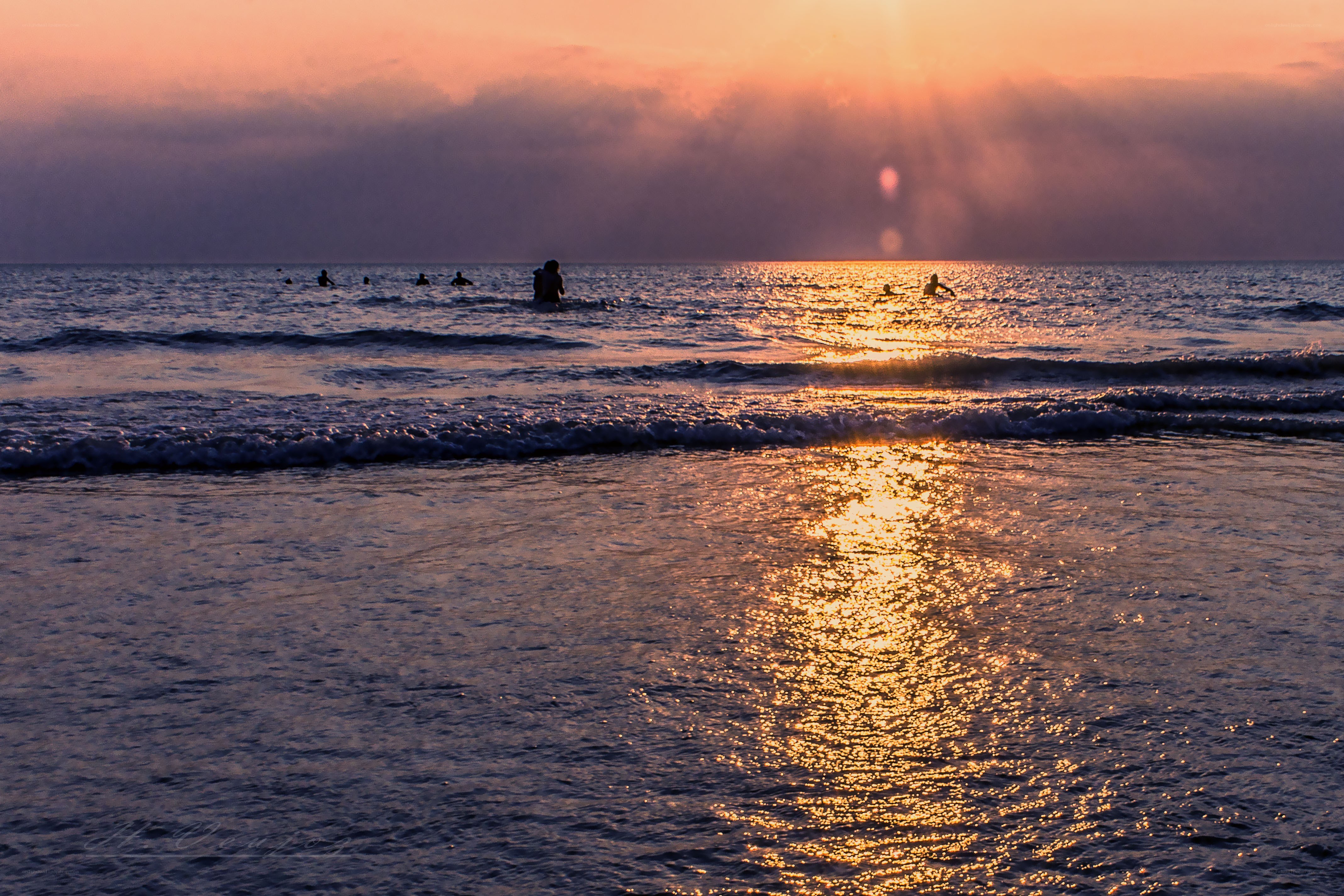 Silhouettes at sunset on the beach