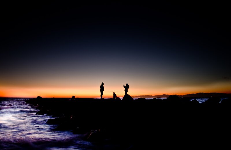 Silhouettes at sunset on the coast
