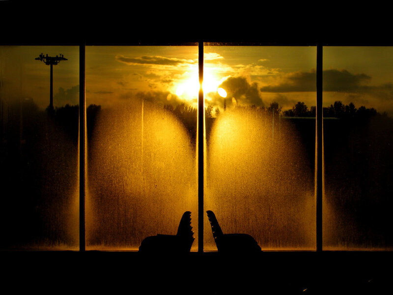 Silhouettes at sunset with fountain