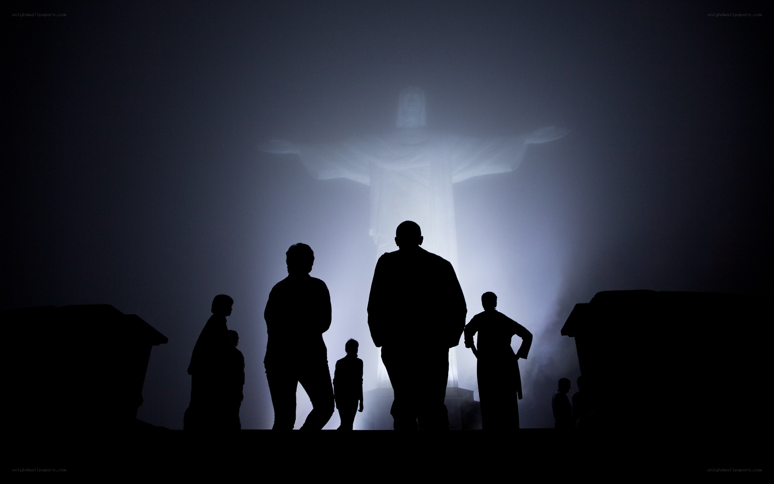 Silhouettes before Christ the Redeemer