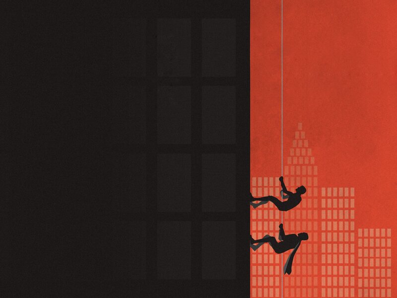 Silhouettes climbing building