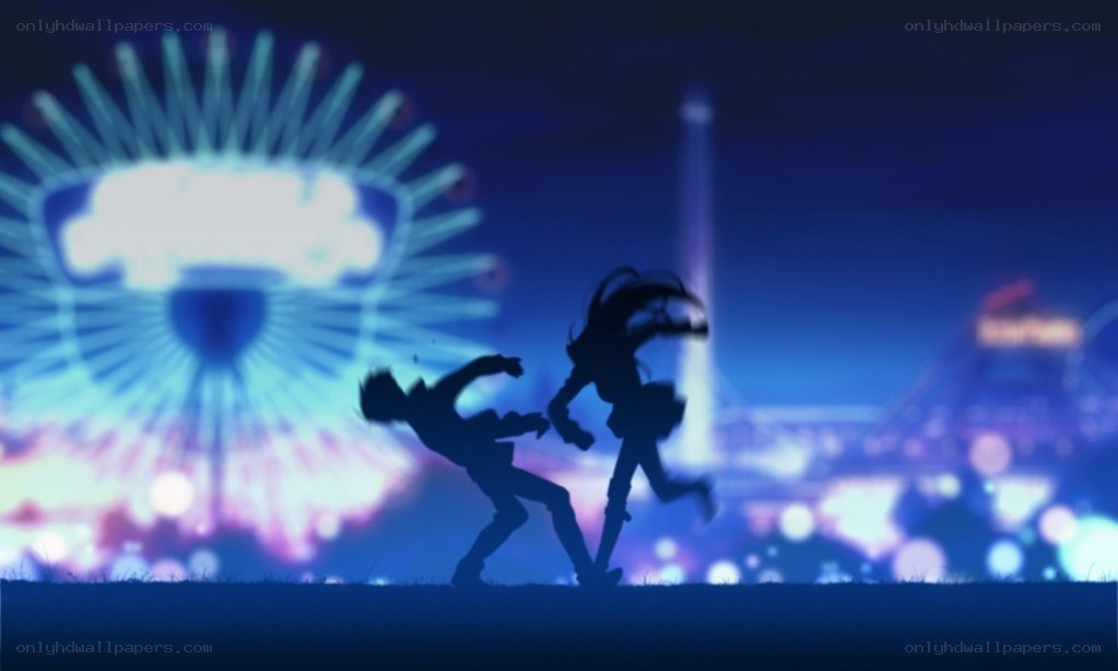Silhouettes in a city at night