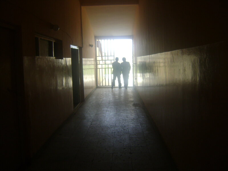 silhouettes in a dim hallway