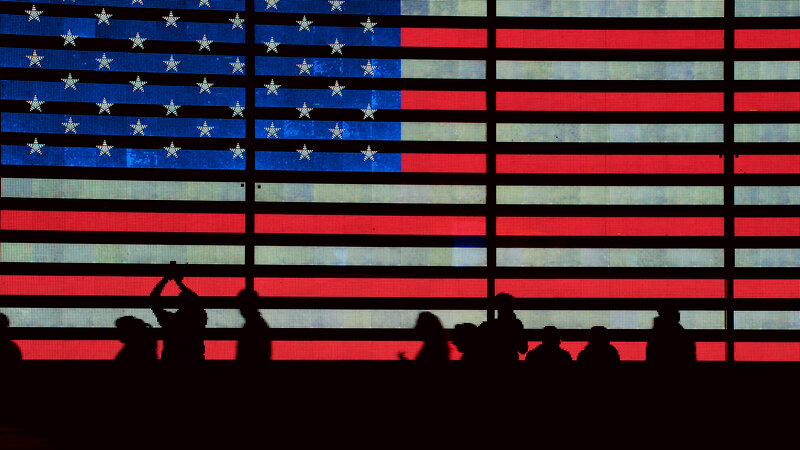 Silhouettes in Front of Flag
