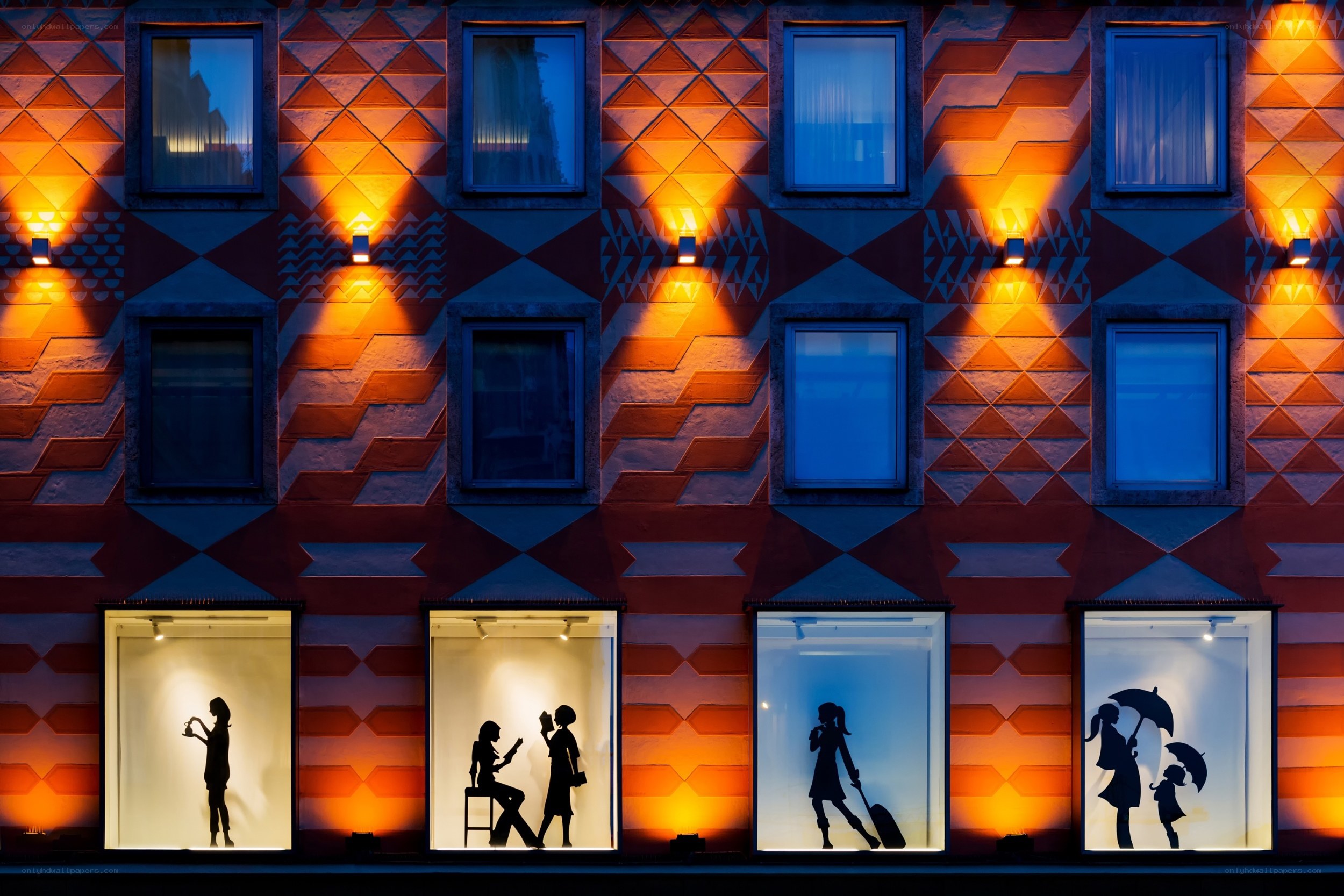 Silhouettes in illuminated windows
