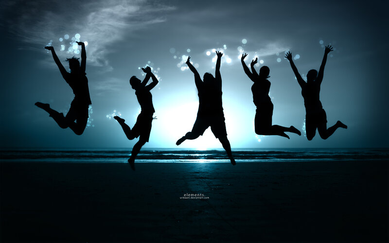 silhouettes jumping on beach