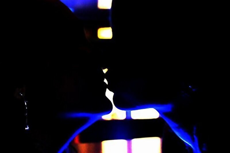 silhouettes kissing at night
