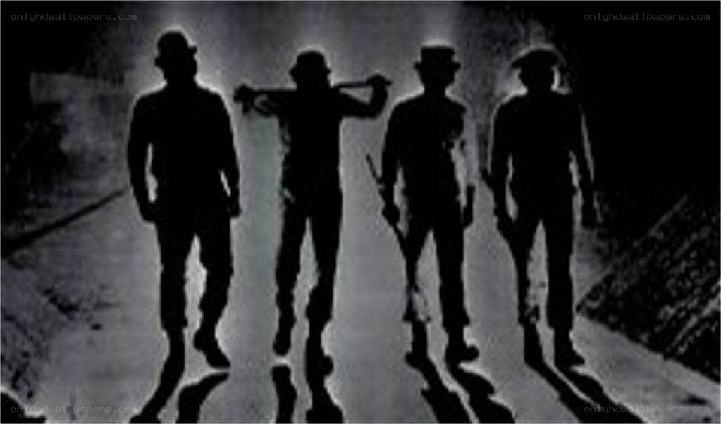 silhouettes of armed men