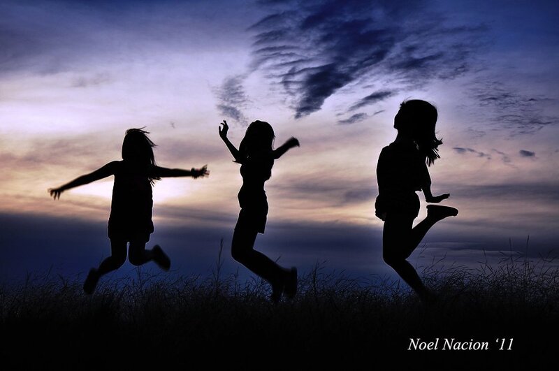 Silhouettes of Children Jumping
