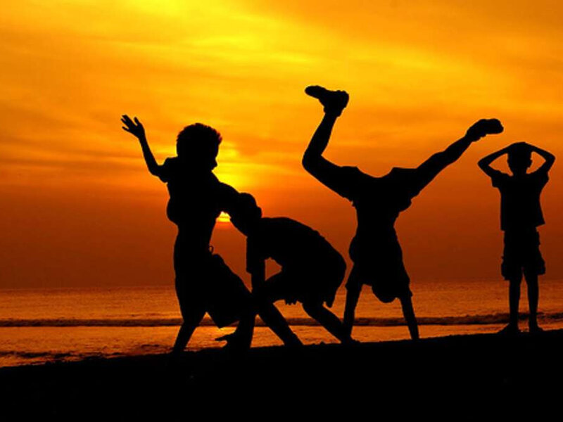 Silhouettes of Children Playing — Orange