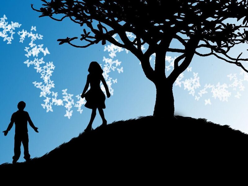 Silhouettes of children under a tree