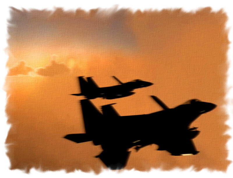 Silhouettes of fighter jets at sunset
