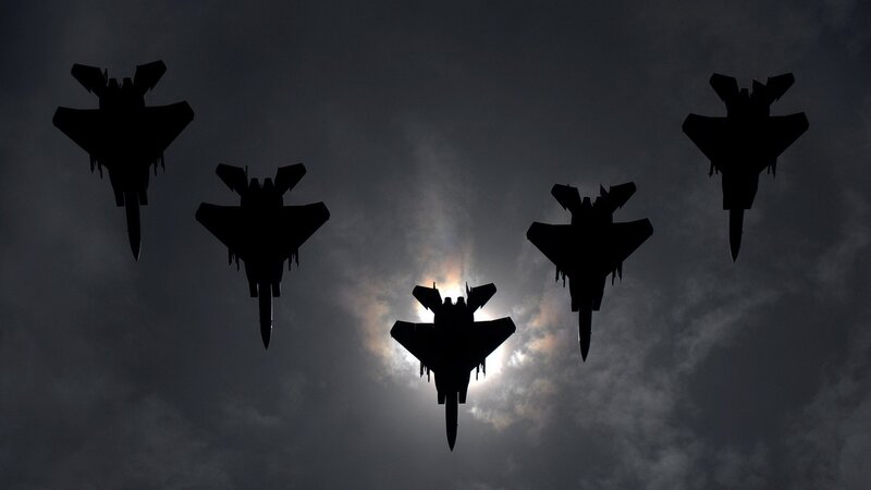 Silhouettes of fighter jets in formation