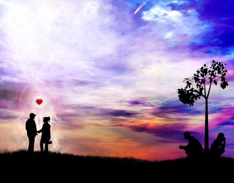 Silhouettes of lovers at sunset