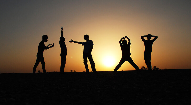 silhouettes of people at sunset
