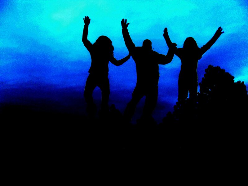 silhouettes of people celebrating