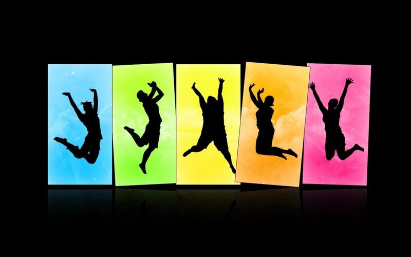 silhouettes of people jumping