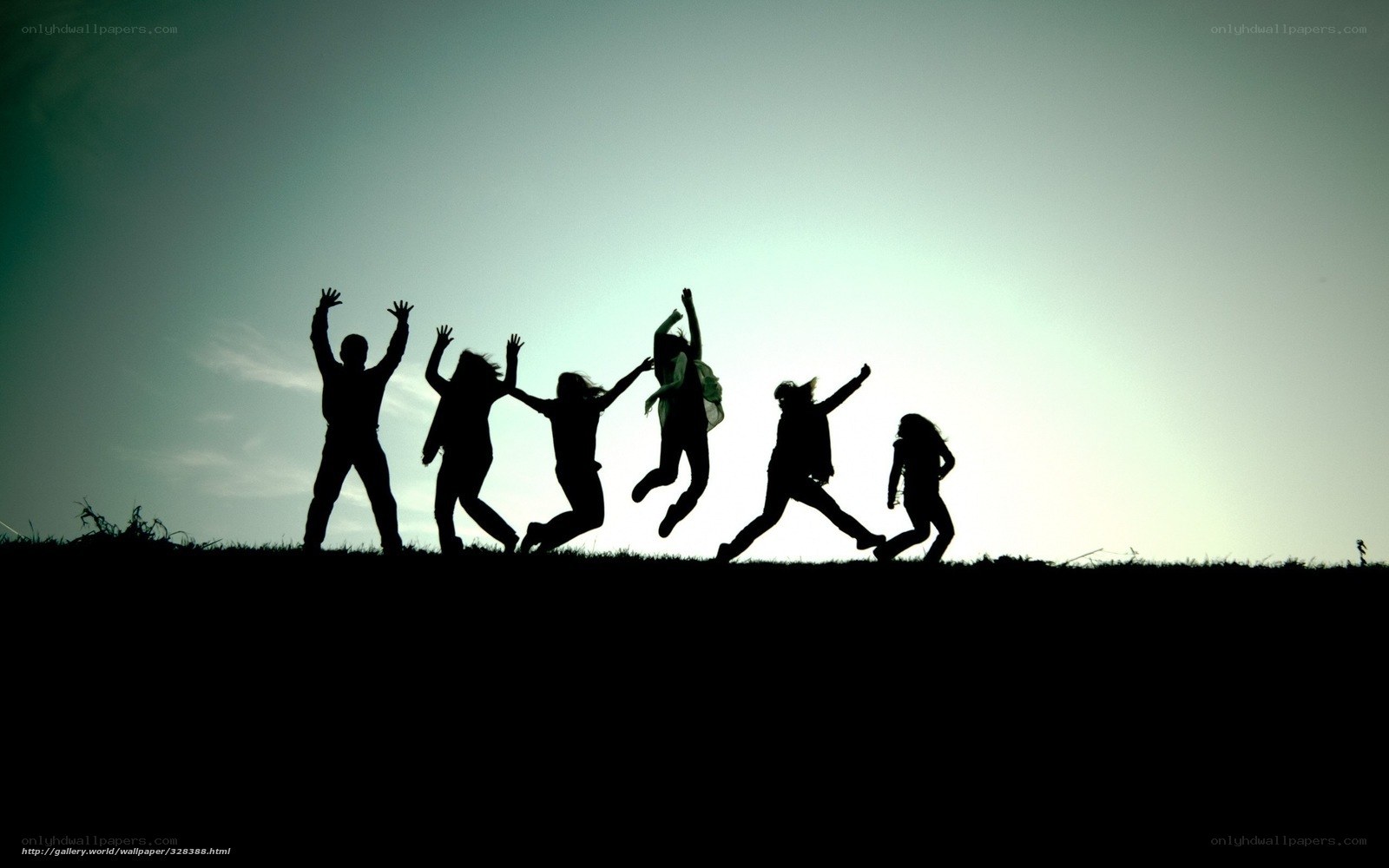 silhouettes of people jumping