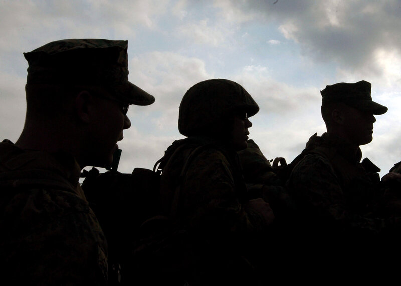 Silhouettes of soldiers in profile